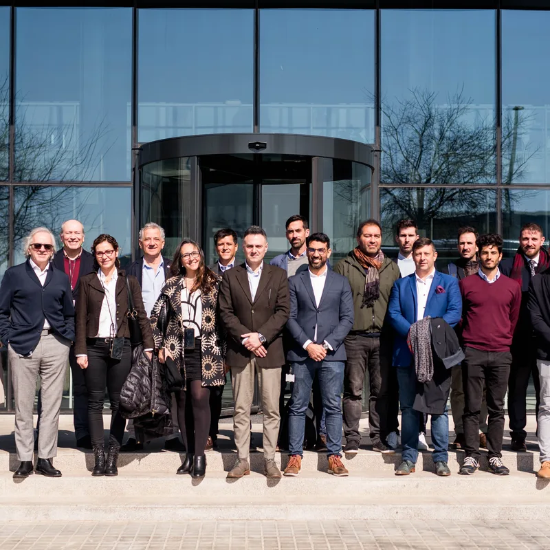 IMHOIT team group at building